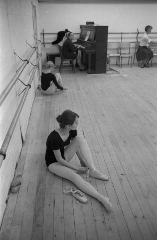 Ballet dancer sitting on floor